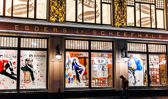 Christmas windows with fashion illustrations in luxury store.